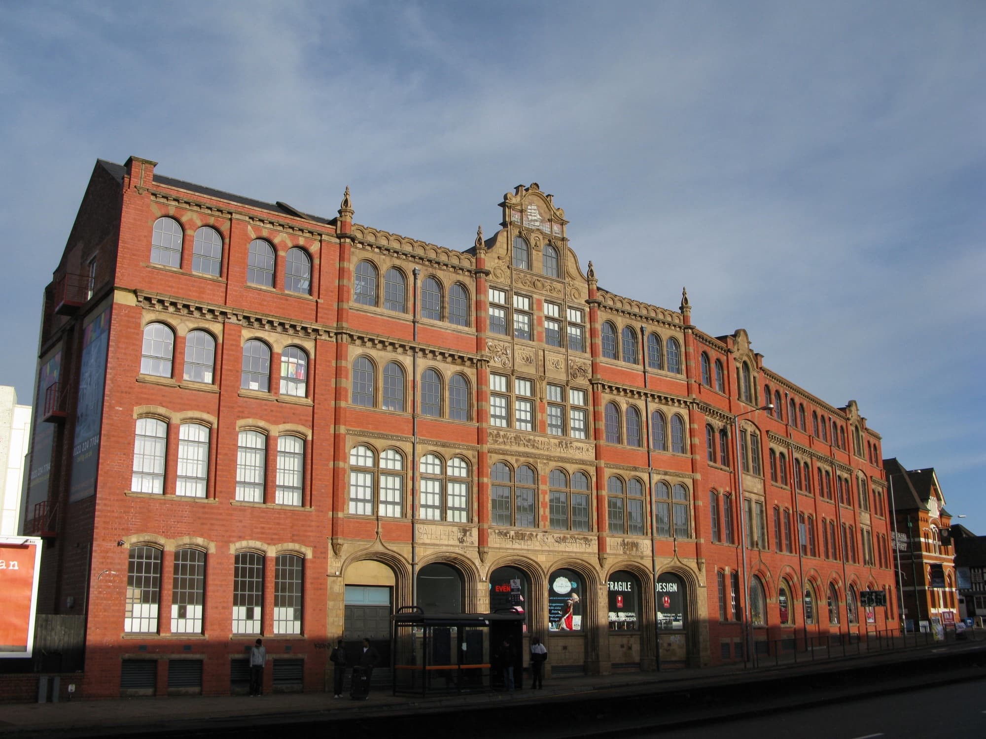 Exterior of the Custard Factory (the Grade II listed former Devonshire House), Digbeth, Birmingham, on a clear day.